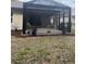Enjoy outdoor living in this screened-in patio with lovely landscaping and a peaceful sitting area at 7393 West Lenox Cir, Punta Gorda, FL 33950