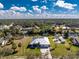 Aerial view of the property with surrounding trees and canal at 1052 Eppinger Dr, Port Charlotte, FL 33953