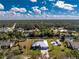 Aerial view of the property with a pool and canal access at 1052 Eppinger Dr, Port Charlotte, FL 33953