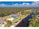 An aerial view of a waterfront property with a pool and canal access at 1052 Eppinger Dr, Port Charlotte, FL 33953