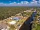 An aerial view of a waterfront property with a pool and canal access at 1052 Eppinger Dr, Port Charlotte, FL 33953