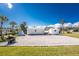 Spacious backyard with gravel parking and multiple storage sheds, ideal for RV parking at 1052 Eppinger Dr, Port Charlotte, FL 33953