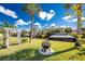 Backyard view featuring a fire pit and an arbor, providing a charming outdoor space at 1052 Eppinger Dr, Port Charlotte, FL 33953