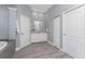 Bright bathroom featuring a soaking tub, walk-in shower and double vanity at 1052 Eppinger Dr, Port Charlotte, FL 33953