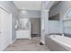 Neutral bathroom featuring a walk-in shower, soaking tub and and sinks at 1052 Eppinger Dr, Port Charlotte, FL 33953