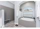 Spa-like bathroom featuring a soaking tub, walk-in shower and elegant finishes at 1052 Eppinger Dr, Port Charlotte, FL 33953