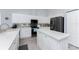 Bright kitchen with white cabinets, granite countertops, modern appliances, and center island with stainless steel appliances at 1052 Eppinger Dr, Port Charlotte, FL 33953