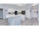 Bright kitchen featuring white cabinetry, a functional island, stainless steel appliances, and recessed lighting at 1052 Eppinger Dr, Port Charlotte, FL 33953