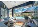 Inviting lanai with comfortable seating area and view of the pool at 1052 Eppinger Dr, Port Charlotte, FL 33953