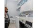 Functional laundry room equipped with a washer, dryer, and ample storage at 1052 Eppinger Dr, Port Charlotte, FL 33953