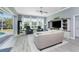 Bright living room with comfy seating, ceiling fan, and access to backyard at 1052 Eppinger Dr, Port Charlotte, FL 33953