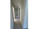 Hallway featuring neutral walls and tile flooring at 2491 Shenandoah St, North Port, FL 34287