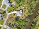 Aerial view showcasing the home's location along a tranquil waterfront at 3896 Slayton Ave, North Port, FL 34286