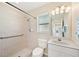 Bathroom featuring a convenient walk-in shower, grab bar, and accessible fixtures at 3896 Slayton Ave, North Port, FL 34286