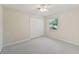 Cozy bedroom features neutral decor, ceiling fan, and closet at 3896 Slayton Ave, North Port, FL 34286