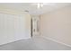 Neutral bedroom featuring ample closet space and access to the en-suite bathroom at 3896 Slayton Ave, North Port, FL 34286