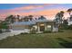 Charming single-story home featuring a well-manicured front yard, attached garage, and neutral color palette at 3896 Slayton Ave, North Port, FL 34286