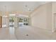 Spacious living room boasts tile and carpet flooring, high ceilings, and sliding glass doors at 3896 Slayton Ave, North Port, FL 34286