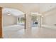 Spacious living room boasts tile and carpet flooring, high ceilings, and sliding glass doors at 3896 Slayton Ave, North Port, FL 34286