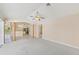 Open-concept living room with decorative pillars at 3896 Slayton Ave, North Port, FL 34286