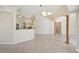 Open-concept living room with tile flooring, natural light, and seamless flow into kitchen area at 3896 Slayton Ave, North Port, FL 34286