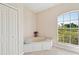Bathroom with soaking tub and large window at 3896 Slayton Ave, North Port, FL 34286
