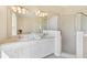 Bathroom featuring dual sinks and walk-in shower at 3896 Slayton Ave, North Port, FL 34286