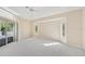 Spacious main bedroom with carpet, fan, and windows at 3896 Slayton Ave, North Port, FL 34286