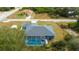 Aerial view of the property showcasing the home, pool, and neighborhood at 9 Logan St, Port Charlotte, FL 33954