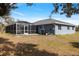 Aerial view of the home showcasing the pool and spacious backyard at 9 Logan St, Port Charlotte, FL 33954