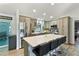Bright kitchen with a large island, stainless steel appliances, and open layout, ideal for entertaining and everyday living at 9 Logan St, Port Charlotte, FL 33954