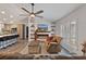 Comfortable living room featuring a modern fireplace, built-in shelves, and natural light from the window at 9 Logan St, Port Charlotte, FL 33954