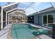 Screened pool boasts an inviting pool with deck area, perfect for relaxation and outdoor enjoyment at 9 Logan St, Port Charlotte, FL 33954