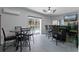 Large recreation room with wet bar, TV, ceiling fan, and access to the outdoor pool area at 9 Logan St, Port Charlotte, FL 33954