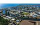 Aerial view of waterfront neighborhood, featuring homes with private docks and ocean access at 125 Ott Cir, Port Charlotte, FL 33952