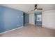 Bedroom featuring tile flooring, ceiling fan, and built in storage cabinets at 125 Ott Cir, Port Charlotte, FL 33952