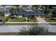 Charming waterfront home with lush lawn, mature palms and a large driveway at 125 Ott Cir, Port Charlotte, FL 33952