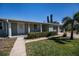 Charming single-story home with a well-maintained lawn and a two-car garage at 125 Ott Cir, Port Charlotte, FL 33952