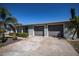Home exterior with a two-car garage and neatly kept landscaping at 125 Ott Cir, Port Charlotte, FL 33952