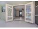View from lanai through french doors to bedroom and pool at 125 Ott Cir, Port Charlotte, FL 33952