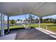 Covered patio with view of a canal and a boat lift at 125 Ott Cir, Port Charlotte, FL 33952