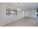 Inviting living room with neutral walls, tile floors and chandelier at 125 Ott Cir, Port Charlotte, FL 33952