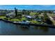 Inviting waterfront home featuring a private dock, boat lift and a screened-in pool for idyllic waterfront living at 125 Ott Cir, Port Charlotte, FL 33952