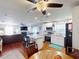 Bright open floor plan seamlessly combines a modern white kitchen with the adjacent living area at 1311 Abscott St, Port Charlotte, FL 33952
