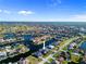 Expansive aerial view of a waterfront community highlighting the canal-front homes at 3415 Tripoli Blvd, Punta Gorda, FL 33950