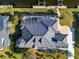Overhead view of a home featuring a boat dock, swimming pool, and an unique roof at 3415 Tripoli Blvd, Punta Gorda, FL 33950