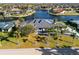 Expansive waterfront home with lush landscaping and a private boat dock, showcasing luxury coastal living at 3415 Tripoli Blvd, Punta Gorda, FL 33950