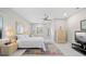 Serene bedroom with a ceiling fan, neutral tones, and ample natural light at 3415 Tripoli Blvd, Punta Gorda, FL 33950