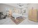 Calm bedroom with a ceiling fan, neutral tones, and two windows with plantation shutters at 3415 Tripoli Blvd, Punta Gorda, FL 33950