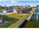 Well-maintained waterfront home with a screened lanai, manicured lawn, and a private dock at 3415 Tripoli Blvd, Punta Gorda, FL 33950